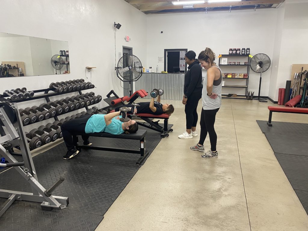 women on benches at group training