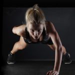 woman doing one-armed pushups